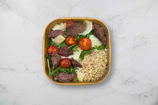 Beef strips with rocket, tomatos and rice